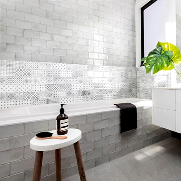 Vita Black and White Decorative Tiles - Bathroom setting with a bath and stool with toiletries