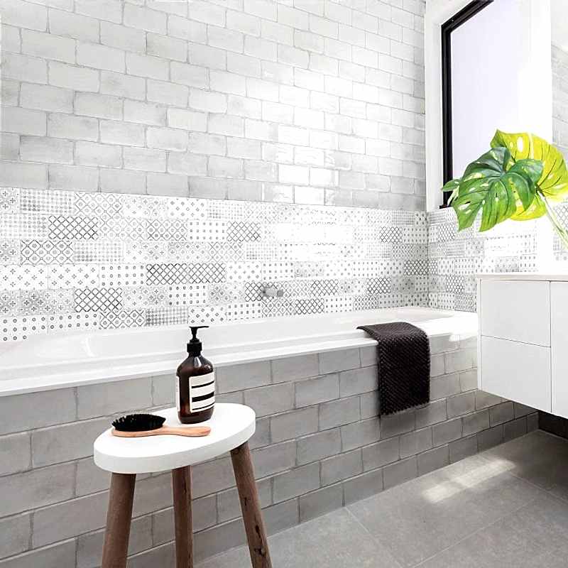 Vita Black and White Decorative Tiles - Bathroom setting with a bath and stool with toiletries