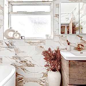 Valeria Gold Marble Effect Tiles in a beautiful modern bathroom