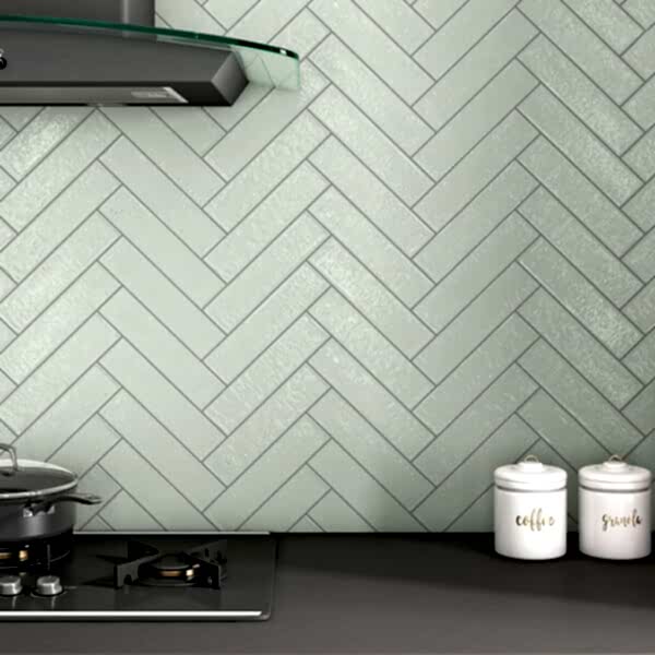 Captiva Sage Green Metro Tiles in a kitchen setting with the tiles in a herringbone layout