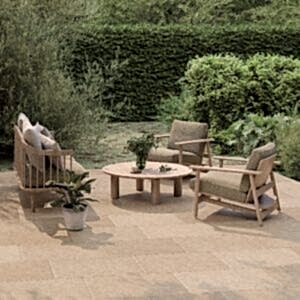 Juliette Sand Stone Effect Tiles in an outdoor setting with chic patio furniture