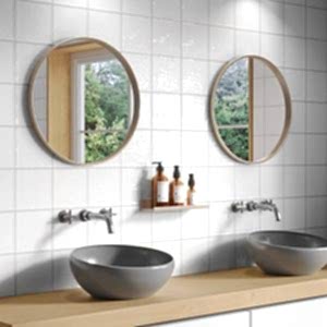 Artisan Small White Square Tiles in a bathroom with two round mirrors and two sinks