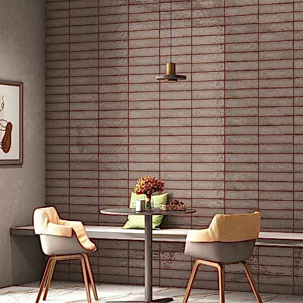Splendour Stone Grey Metro Tiles on the wall in a room with a table and chairs