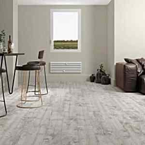 Rustic living room with white wood effect porcelain tiles and cosy furiture set-up along with stylish dining seats.