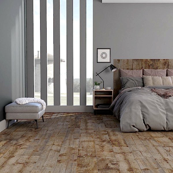 Rustic modern bedroom with beige wood effect tiles and stylish bed set-up with a cozy corner and a well lit-up space