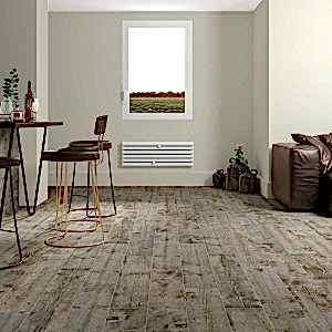 Rustic living room with grey wood tiles and cosy furiture set-up along with stylish dining seats.