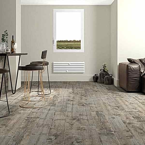 Rustic living room with grey wood tiles and cosy furiture set-up along with stylish dining seats.